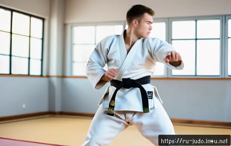 유도와 명상 호흡법 - A focused young adult male practicing judo in a modern dojo, wearing a traditional white judo gi wit...